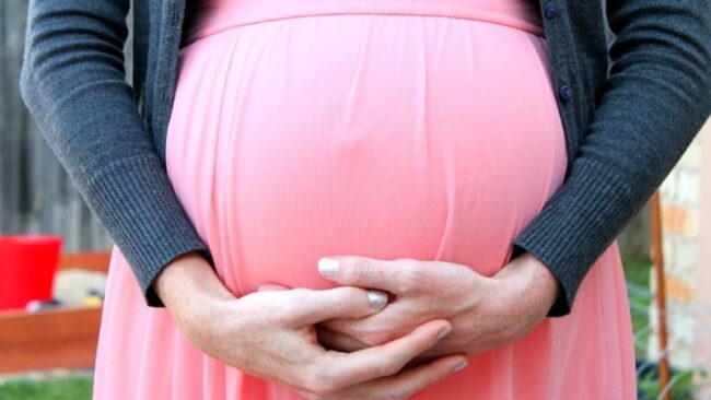 pregnant lady in pink dress