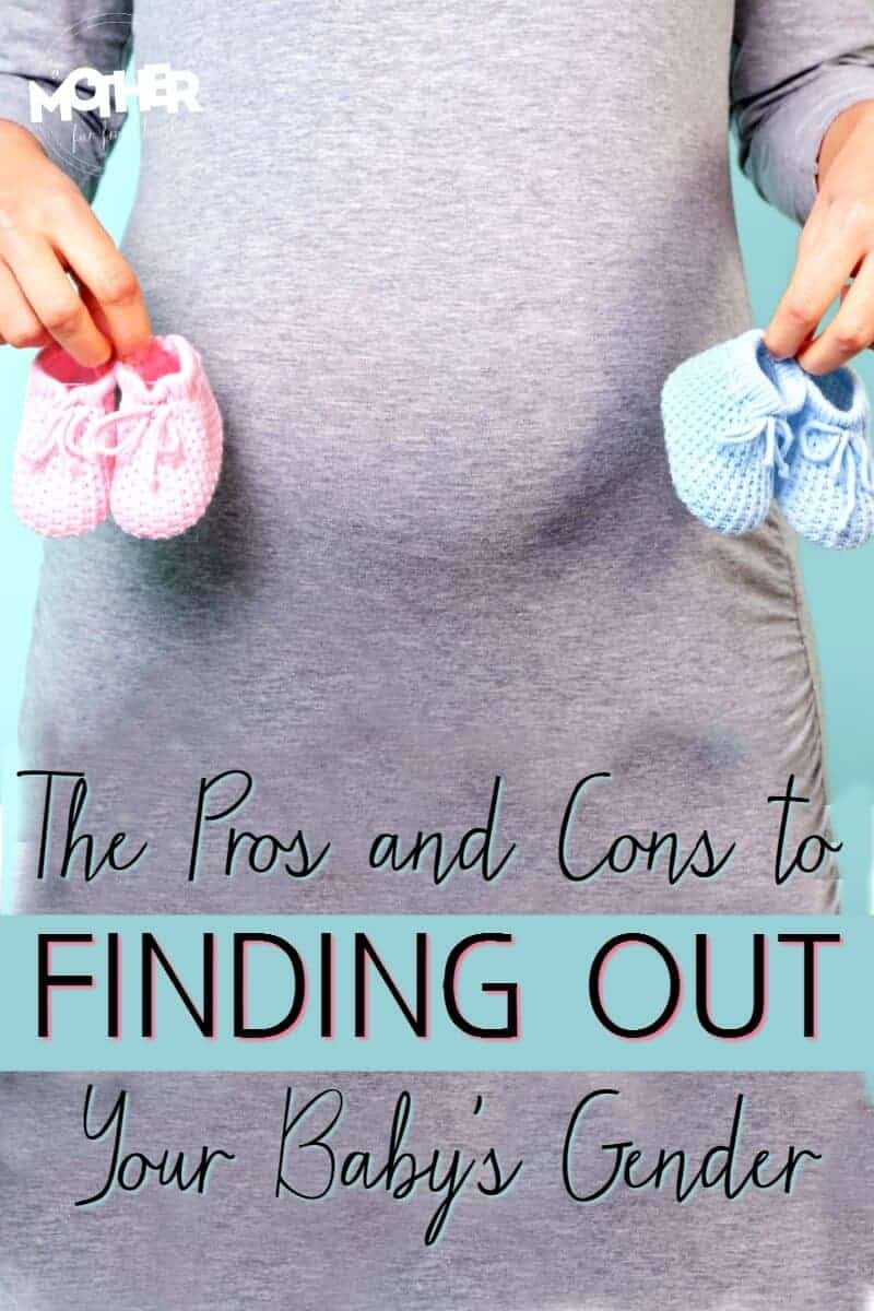 pregnant mom holding blue and pink pairs of baby shoes